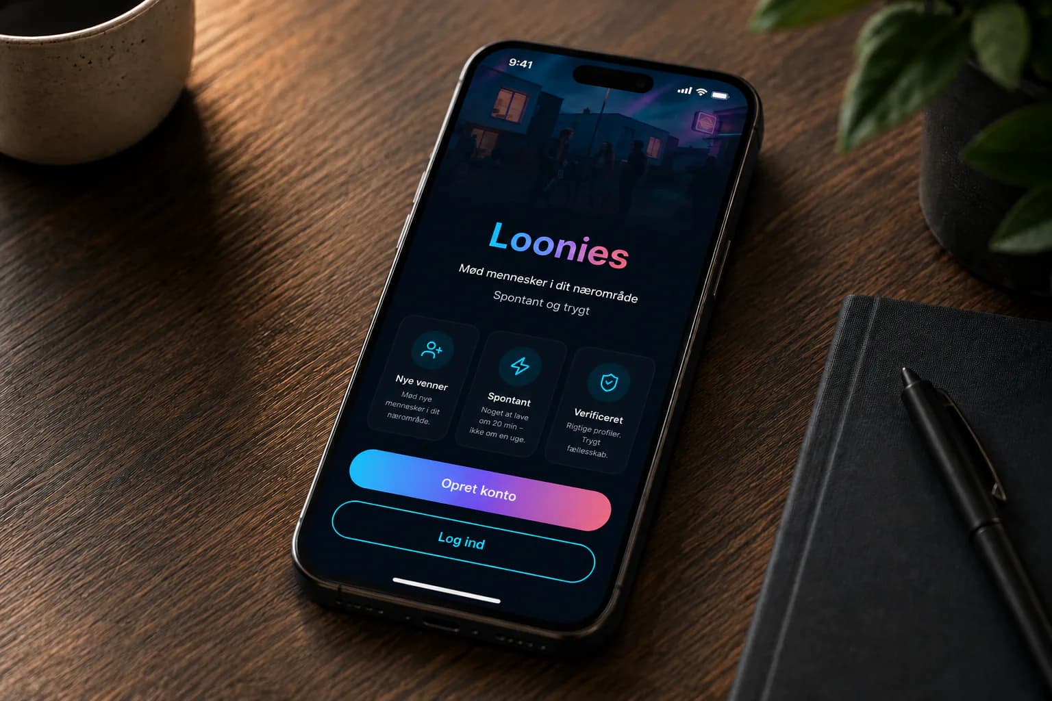 Loonies-appen vist på en iPhone på et træbord